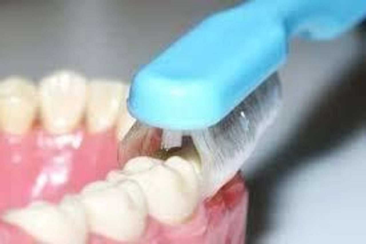 The Collis-Curve Toothbrush